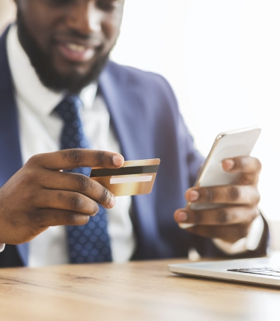 Cropped image of businessman making online payment on phone